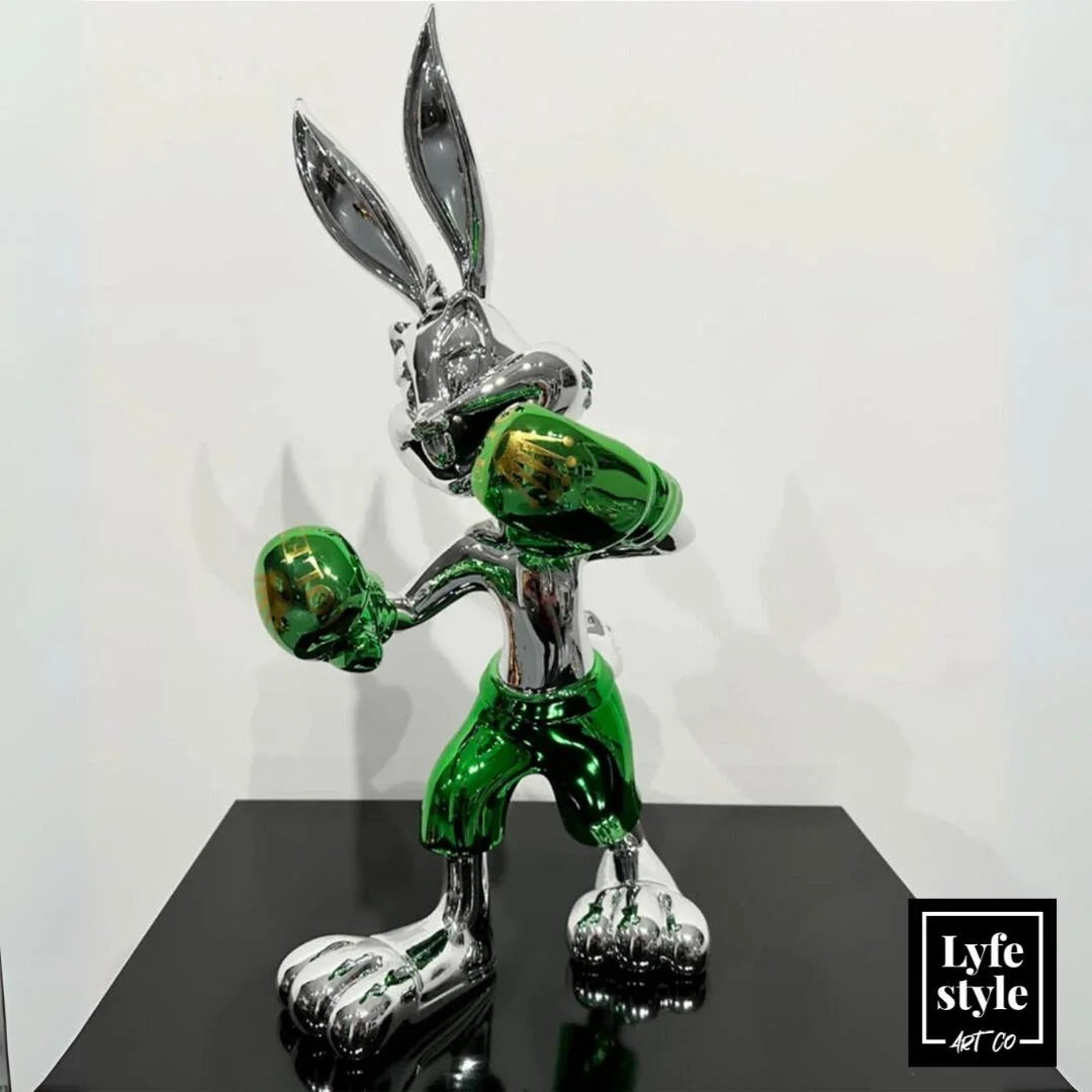 A single green leaf against a white background.